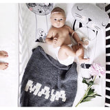 Dark gray blanket & cream name